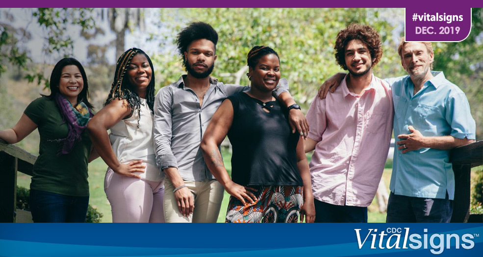 Ending HIV transmission A group of individuals posing on a bridge.