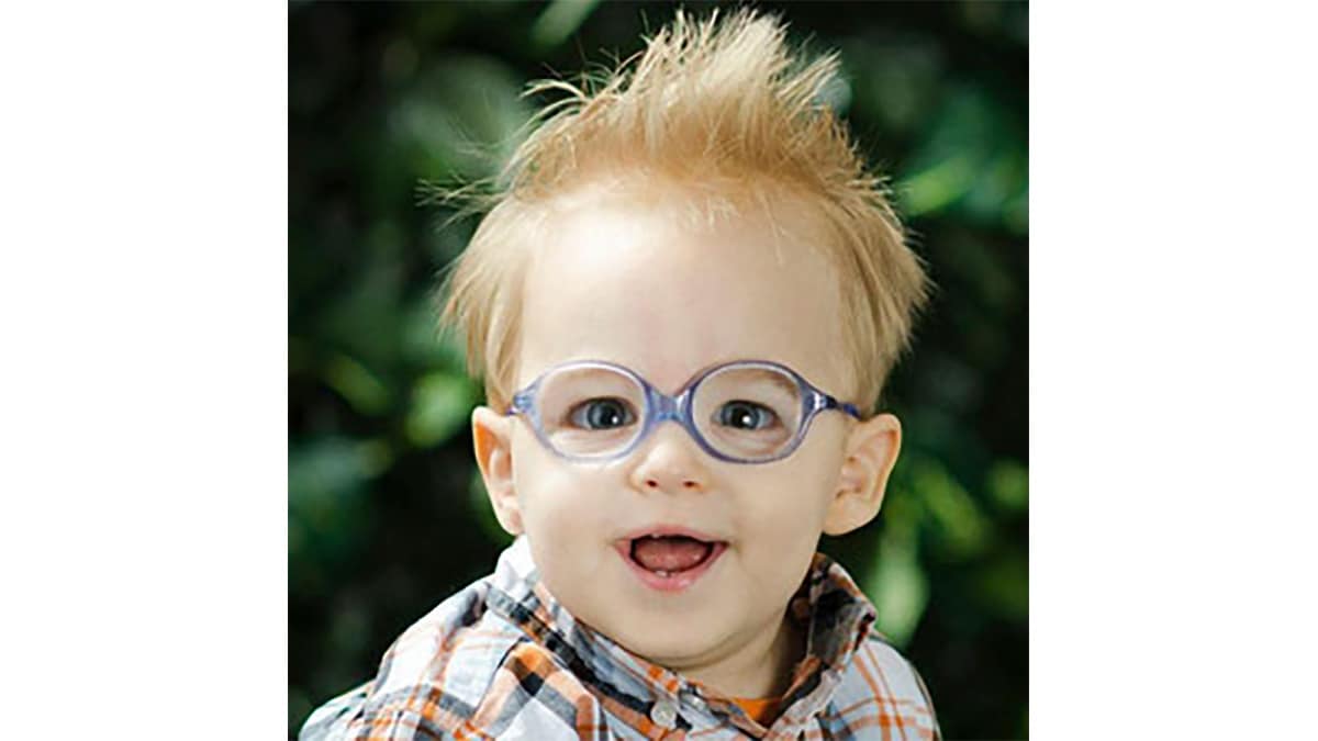 Judah Dearey, a little boy with blond hair and glasses