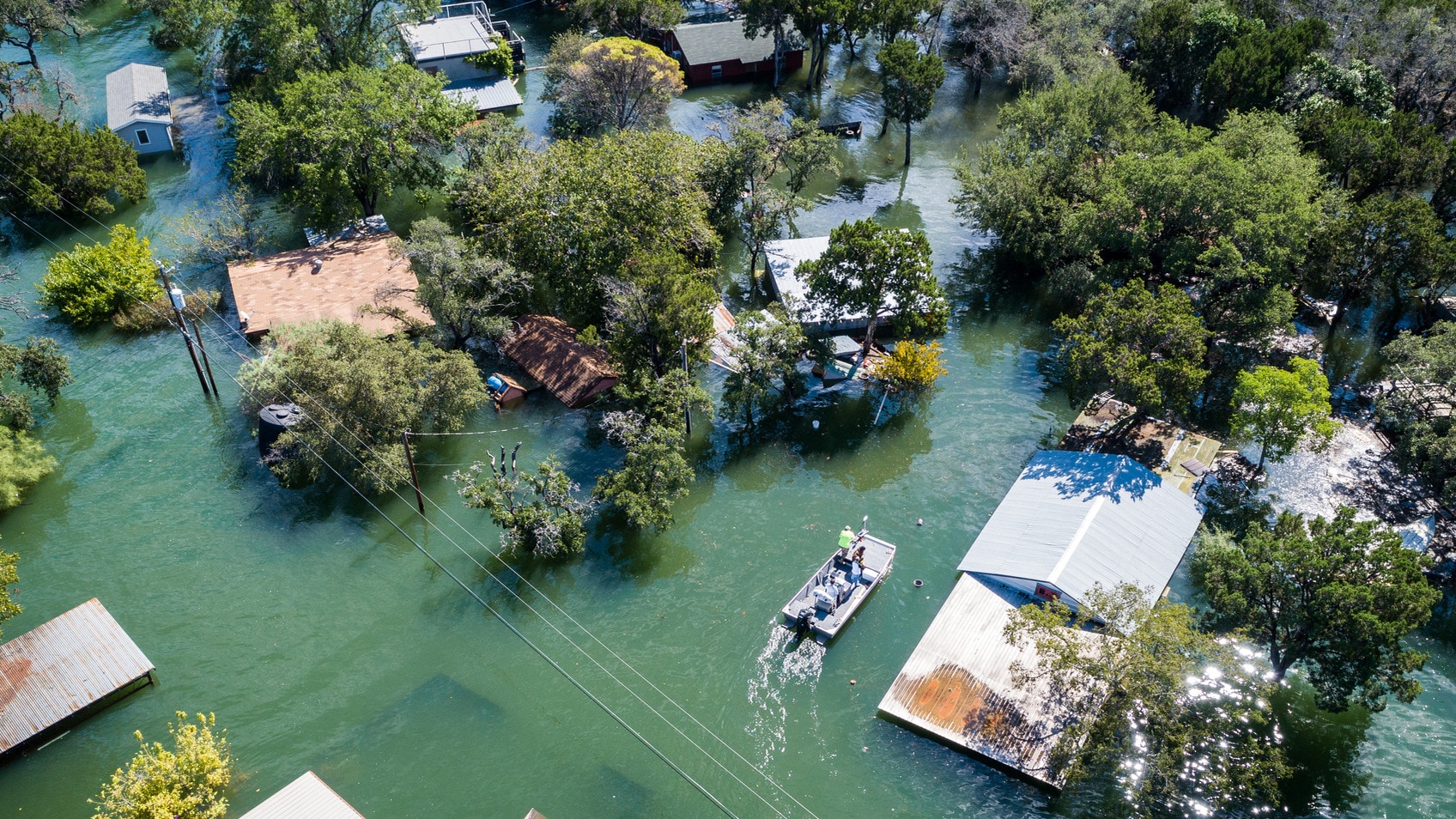 Aerial image of a neighborhood that is flooded after a natural disaster.