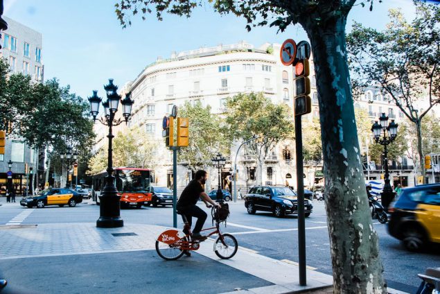 Example image: man on bicycle crossing street