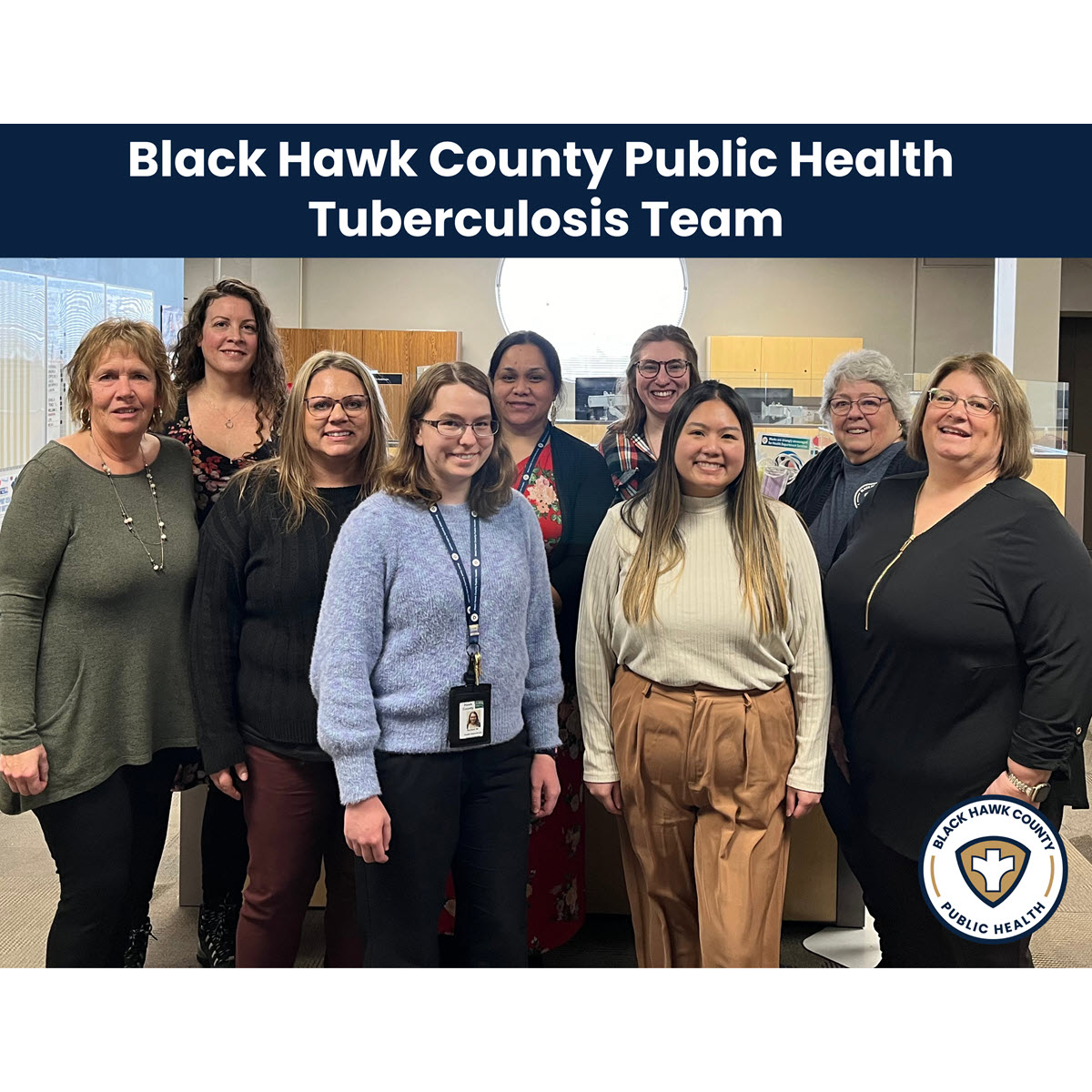 9 women from the TB Team at Black Hawk County Public Health Department standing and smiling