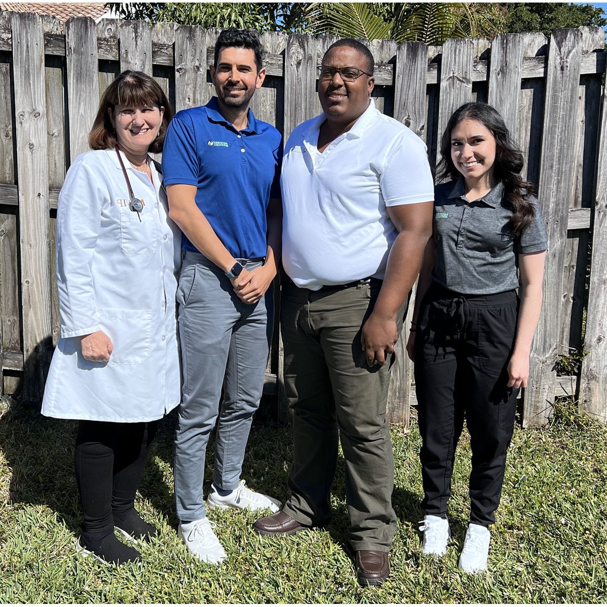 4 Gateway Medical staff standing outside in front of a fence