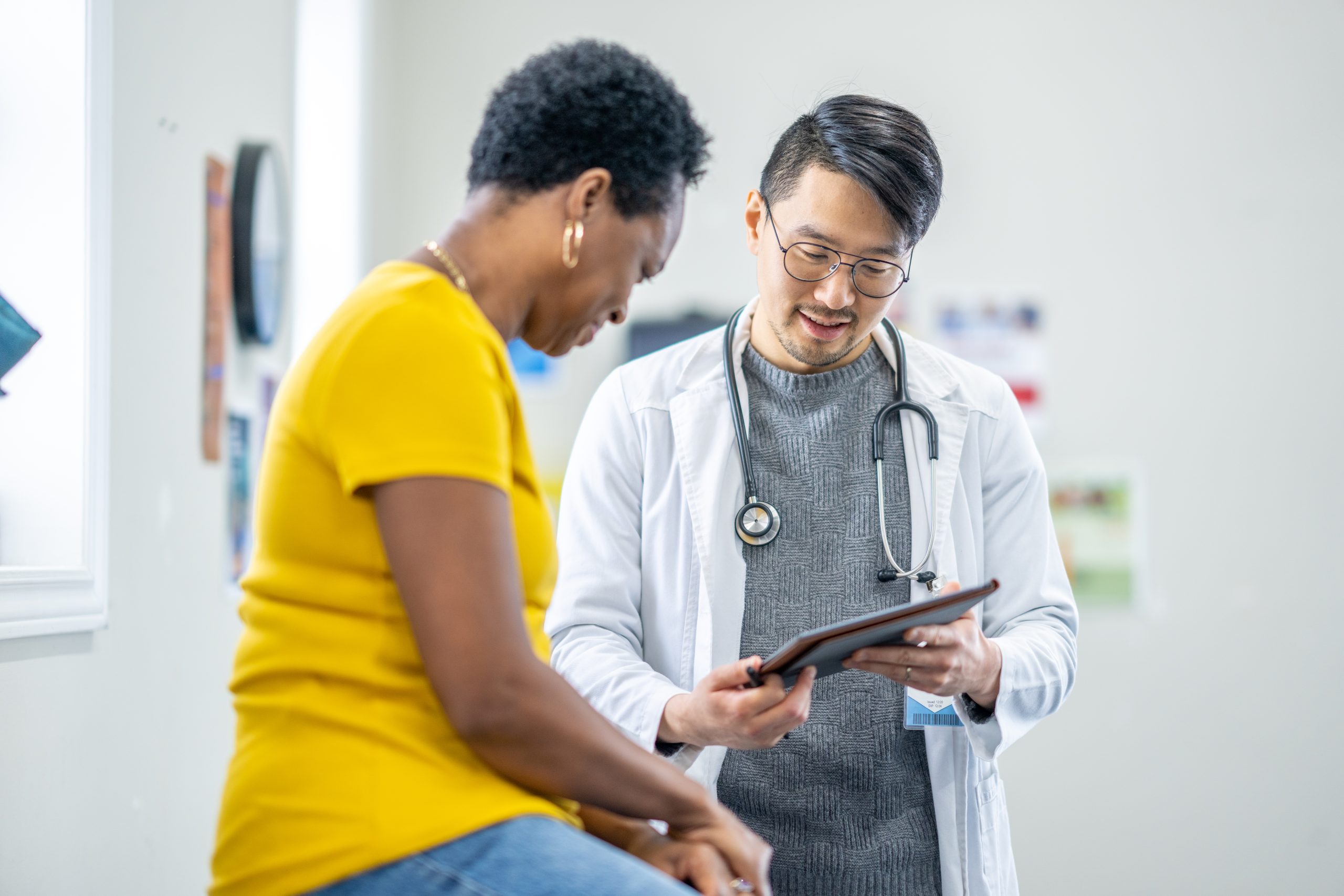 Healthcare professional talking to a traveler.