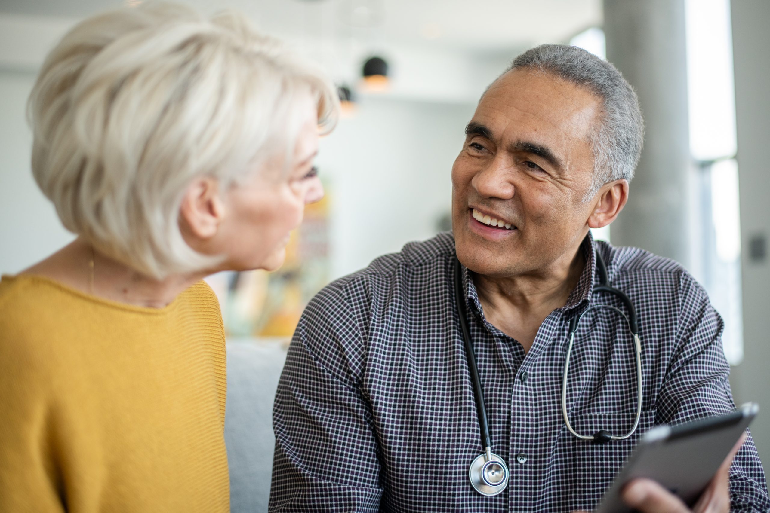 Healthcare professional talking to a traveler.