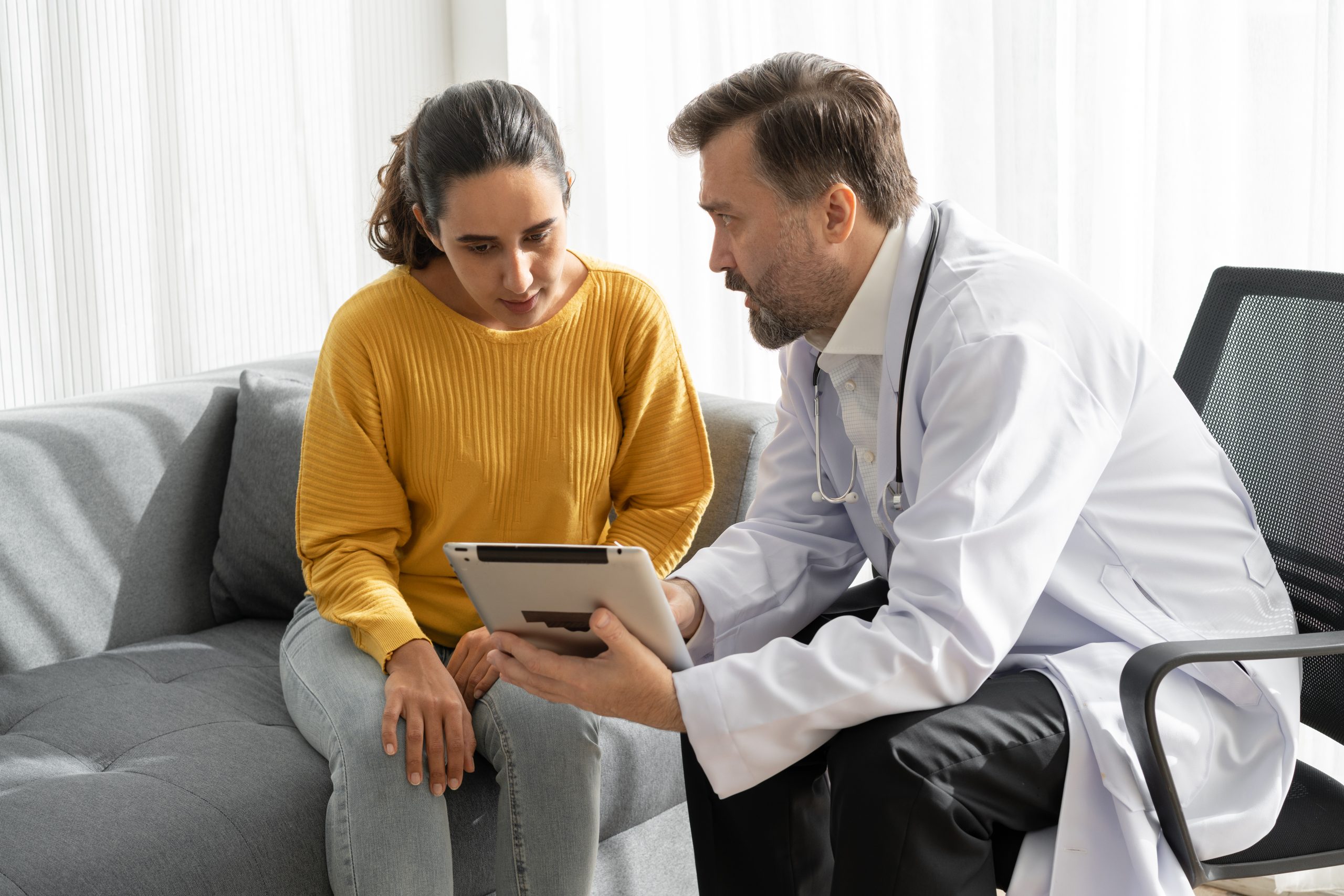 Healthcare professional providing information to a traveler.