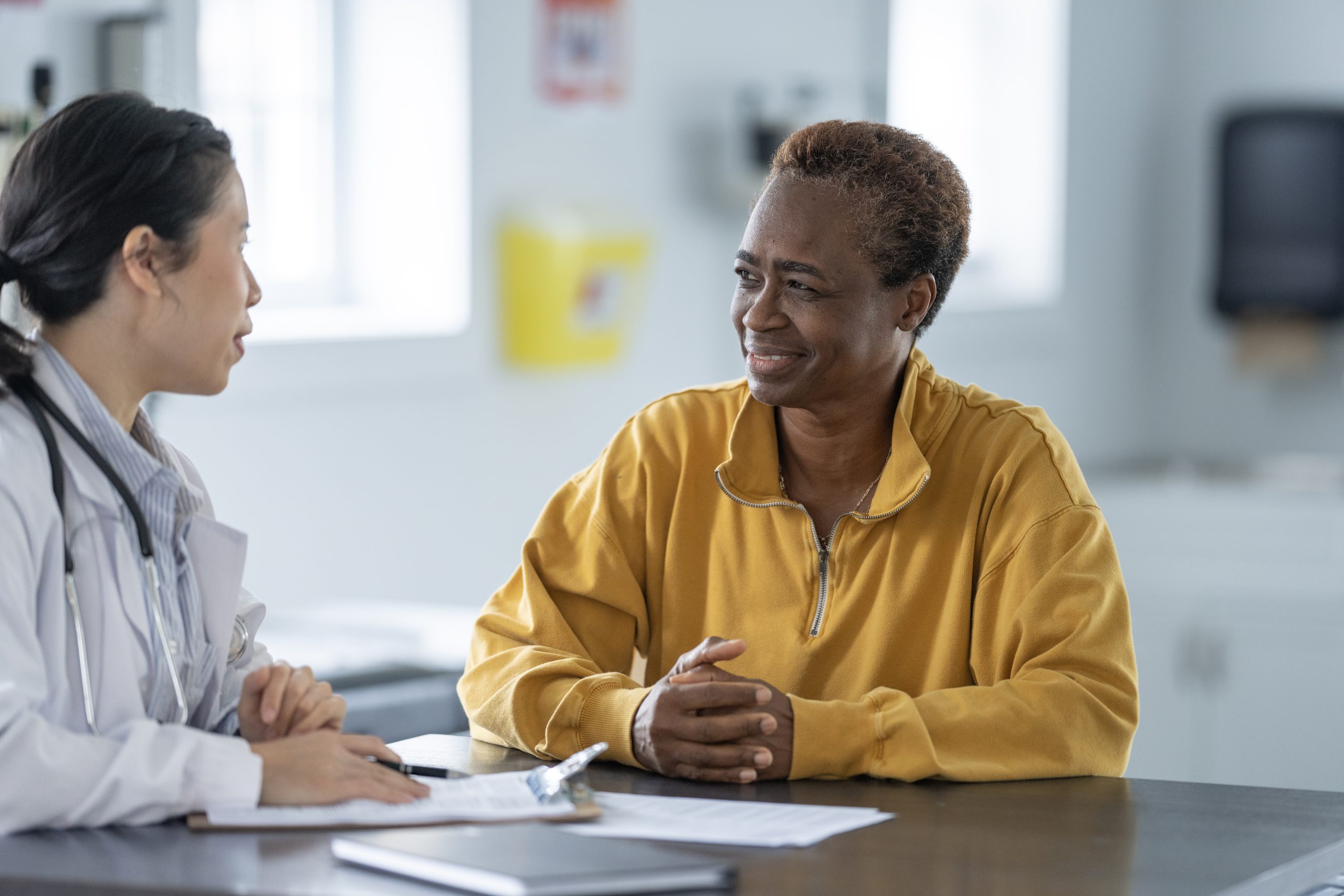 Healthcare professional talking to a traveler.