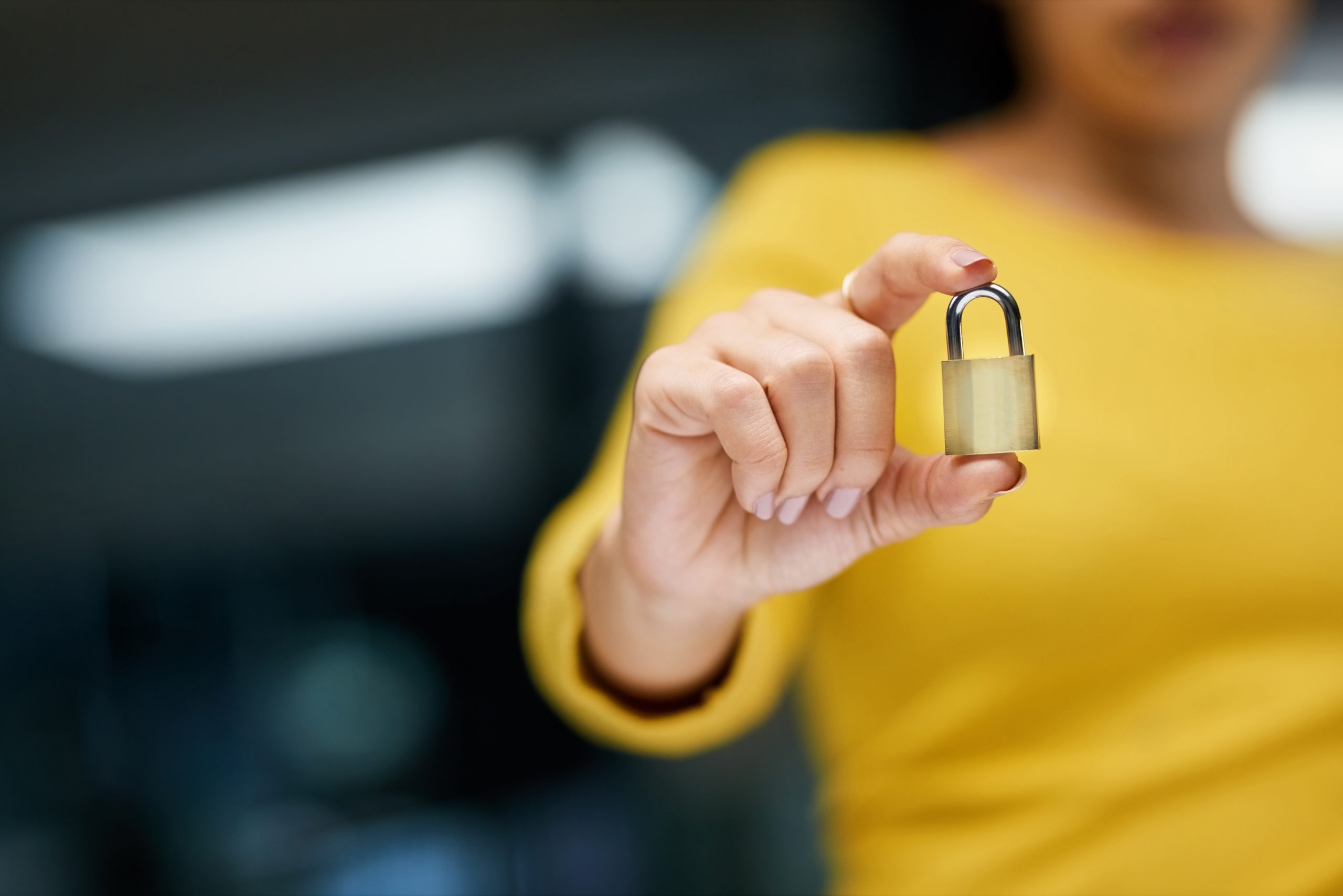 Traveler holding a padlock.