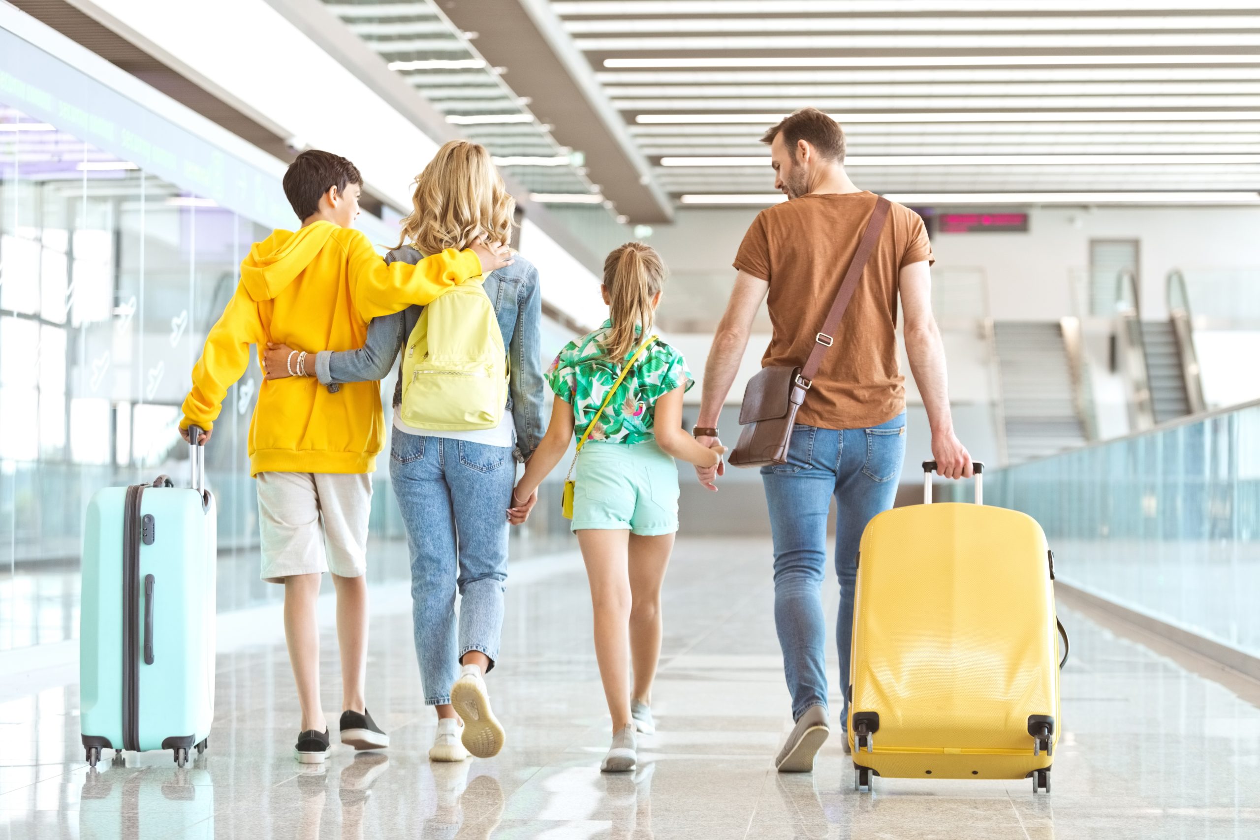 Family walking in an airport.