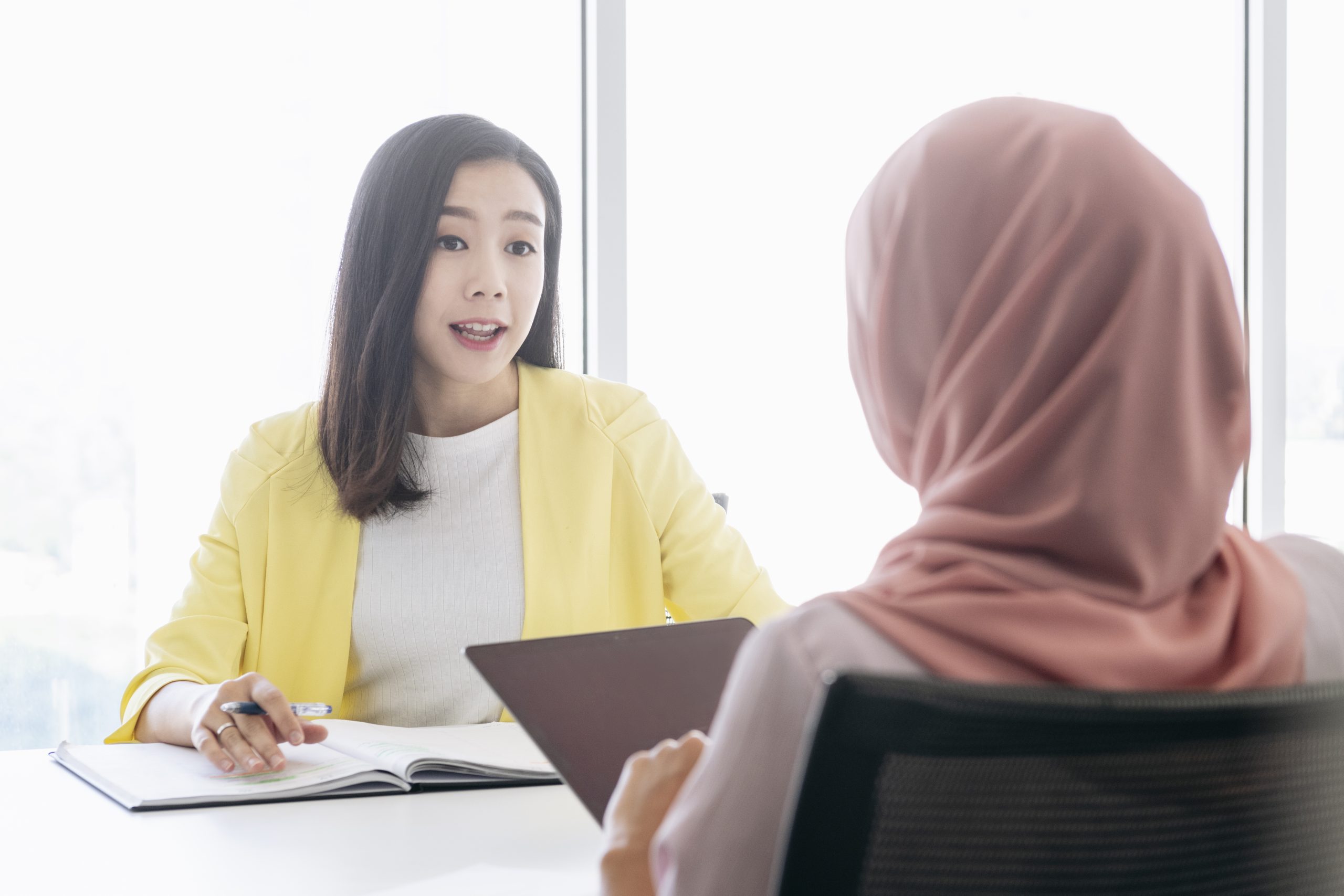 Healthcare professional talking to a traveler.