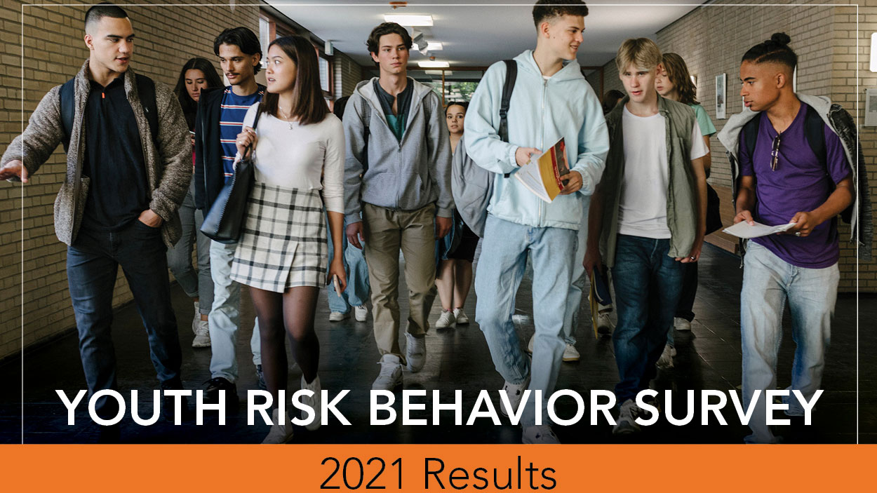 2021 YRBS results banner, showing a group of teen students walking in school hallway.